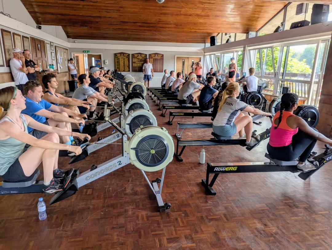 Adult men and women learn to row